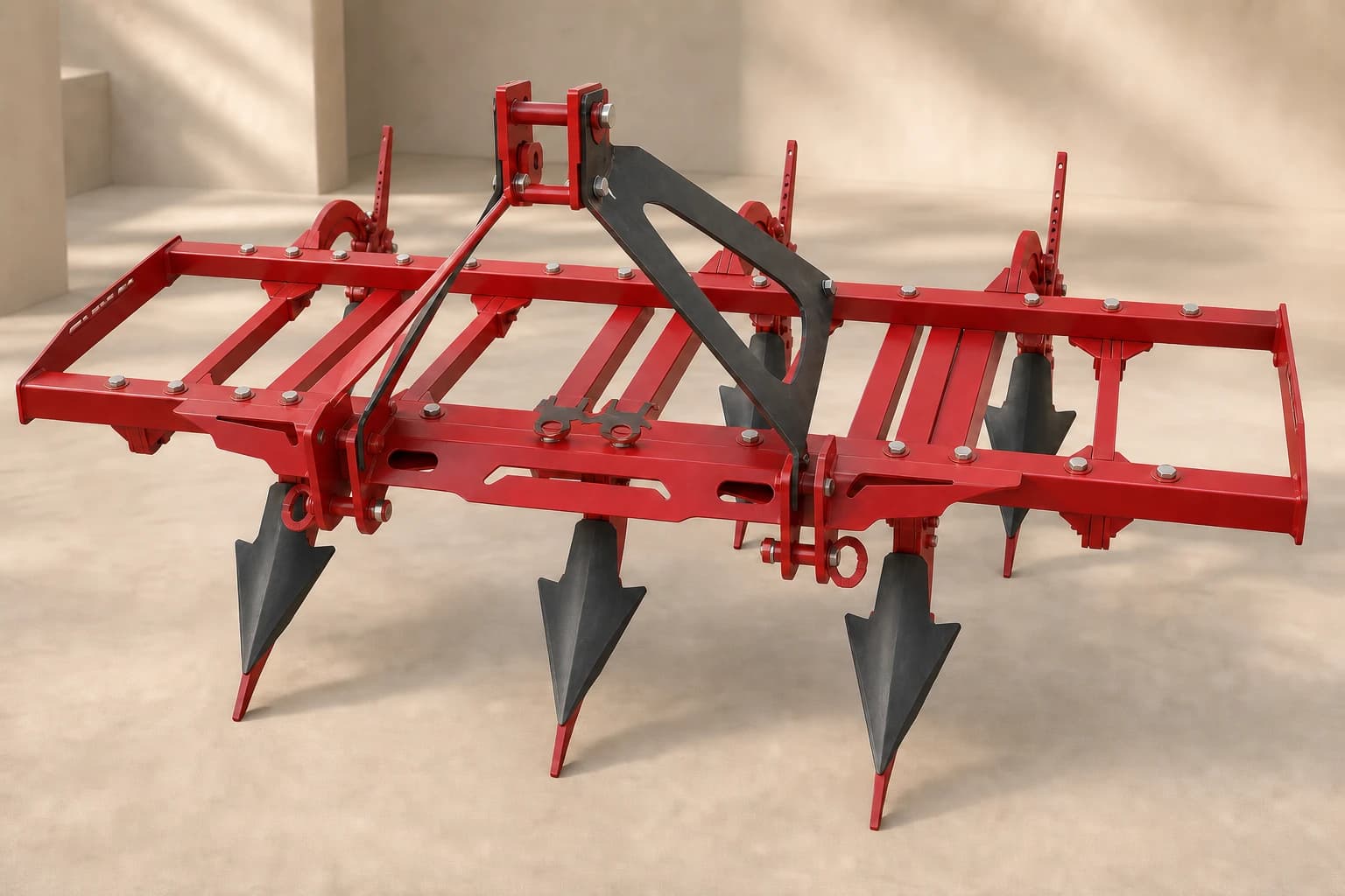 Premium red five-tyne Chisel Plough with tall black vertical arrowhead shares