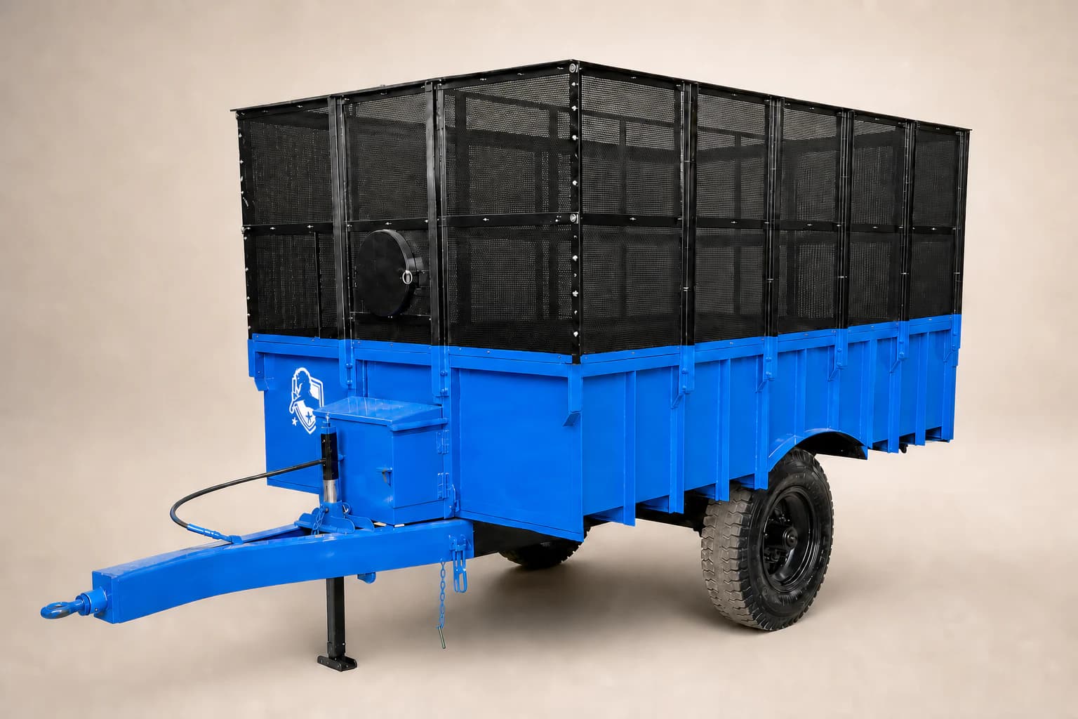 Blue and black single-axle farm trolley shown from a front three-quarter angle